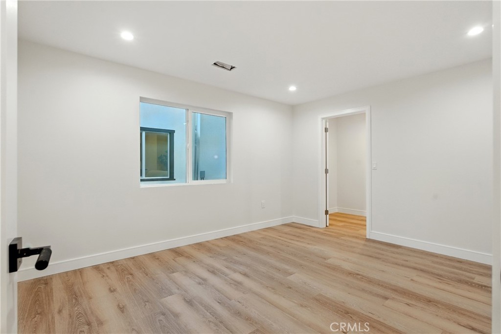 4340 2nd Avenue Los Angeles, CA 90008 - Photo 38 of 51 a view of an empty room with wooden floor and a window
