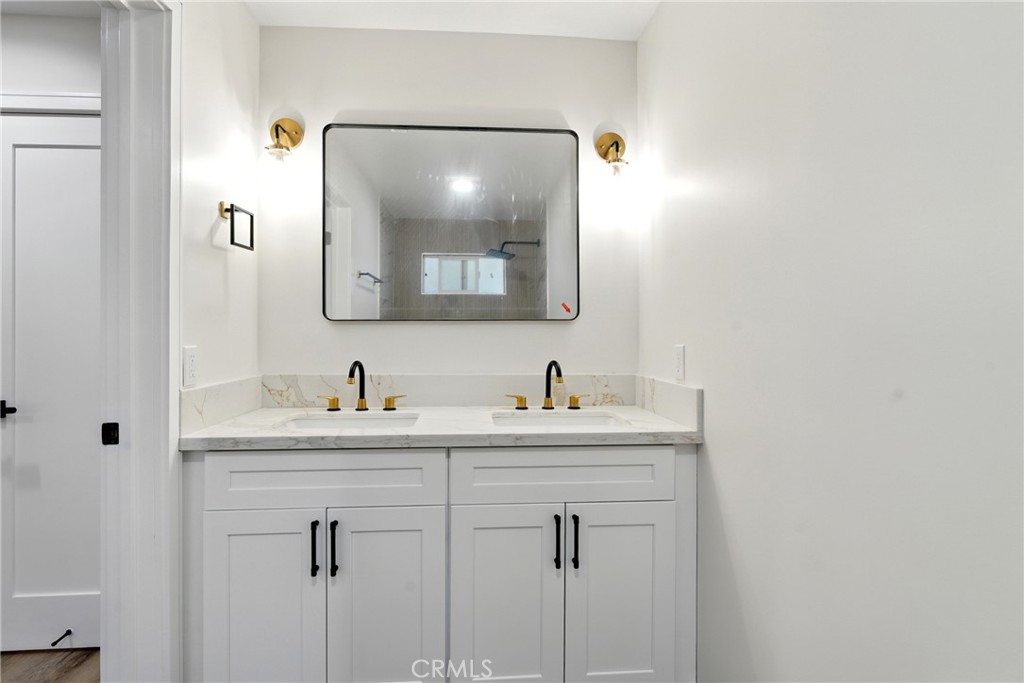 4340 2nd Avenue Los Angeles, CA 90008 - Photo 40 of 51 a bathroom with a sink and a mirror
