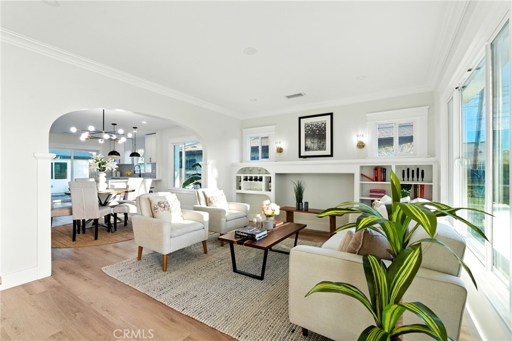 4340 2nd Avenue Los Angeles, CA 90008 - Photo 4 of 51 a living room with furniture a chandelier and a floor to ceiling window