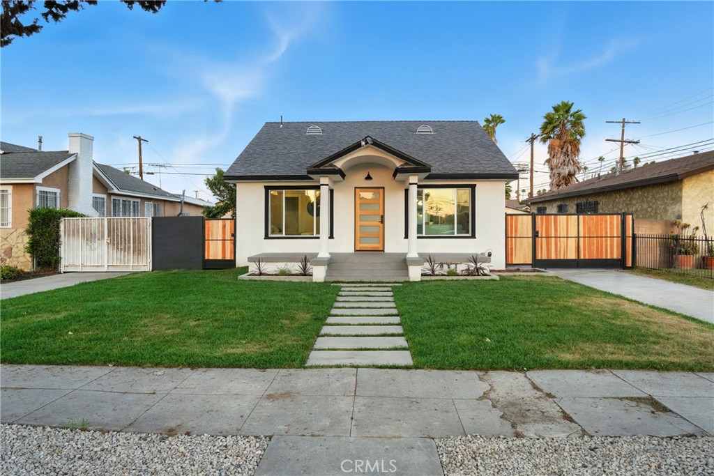 4340 2nd Avenue Los Angeles, CA 90008 - Photo 47 of 51 a front view of a house with a yard