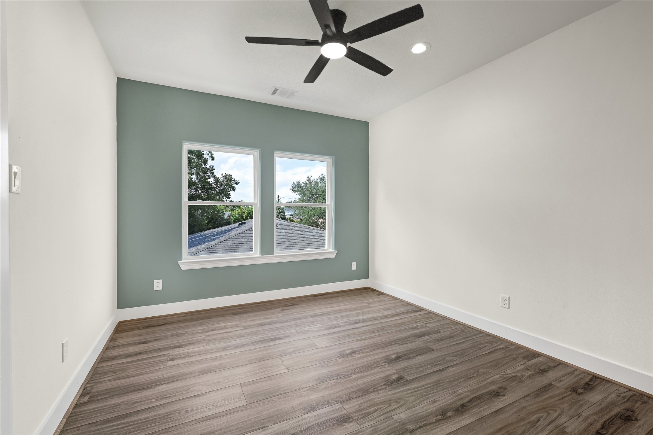 3834 Mt Pleasant Street Houston, TX 77021 - Photo 47 of 50 wooden floor in an empty room with a window