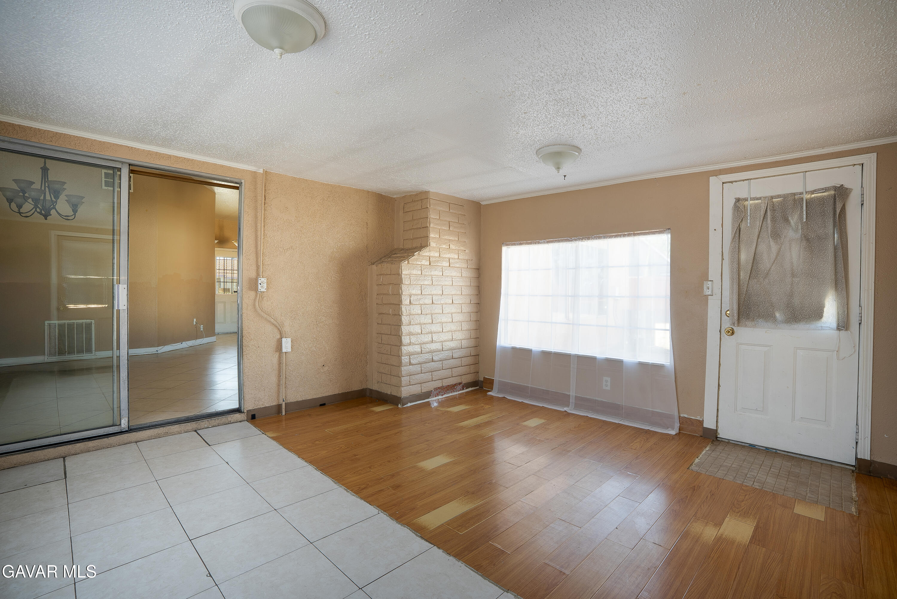 4015 Triton Drive Palmdale, CA 93552 - Photo 13 of 19 wooden floor in an empty room with a window