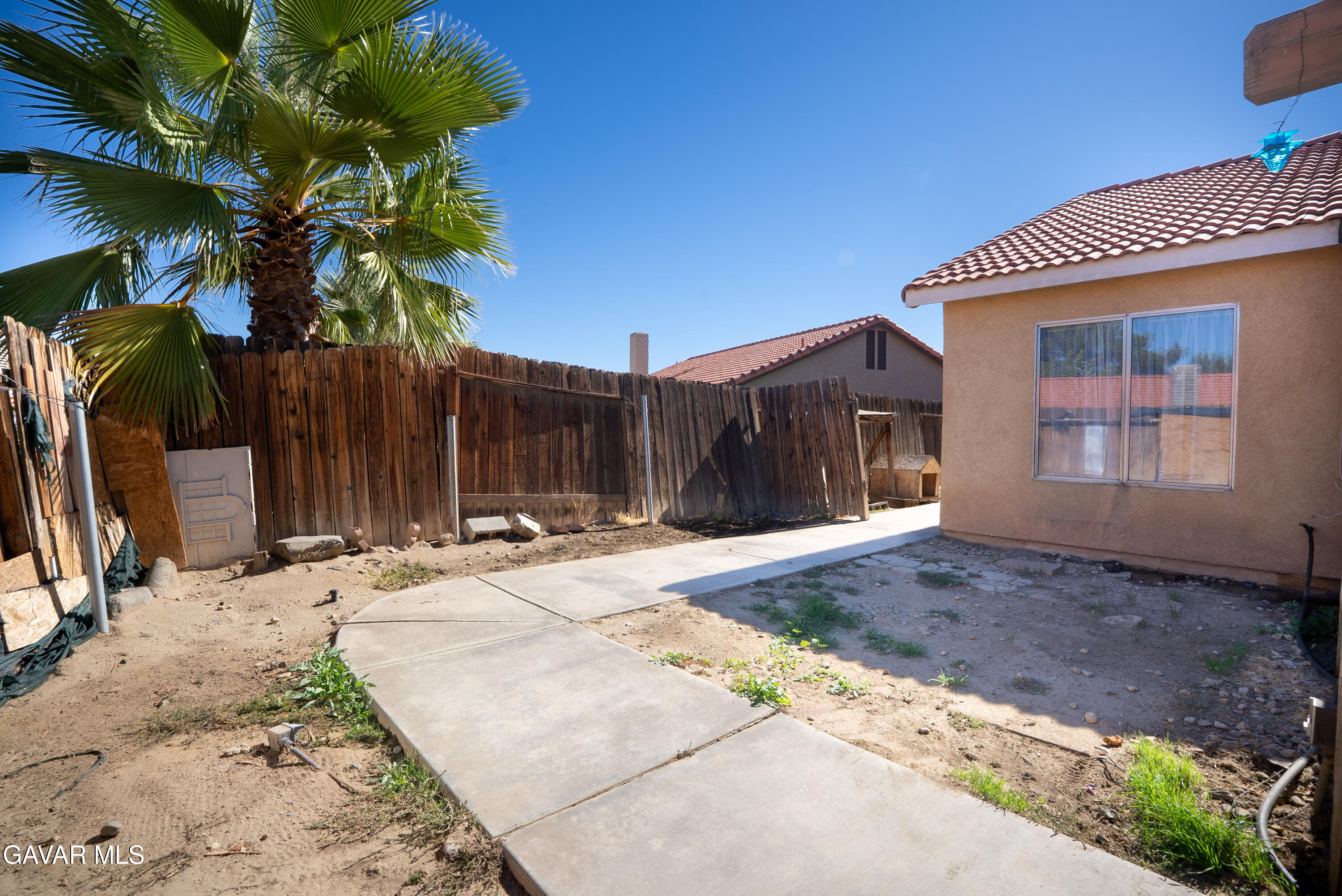 4015 Triton Drive Palmdale, CA 93552 - Photo 16 of 19 a view of a house with a yard
