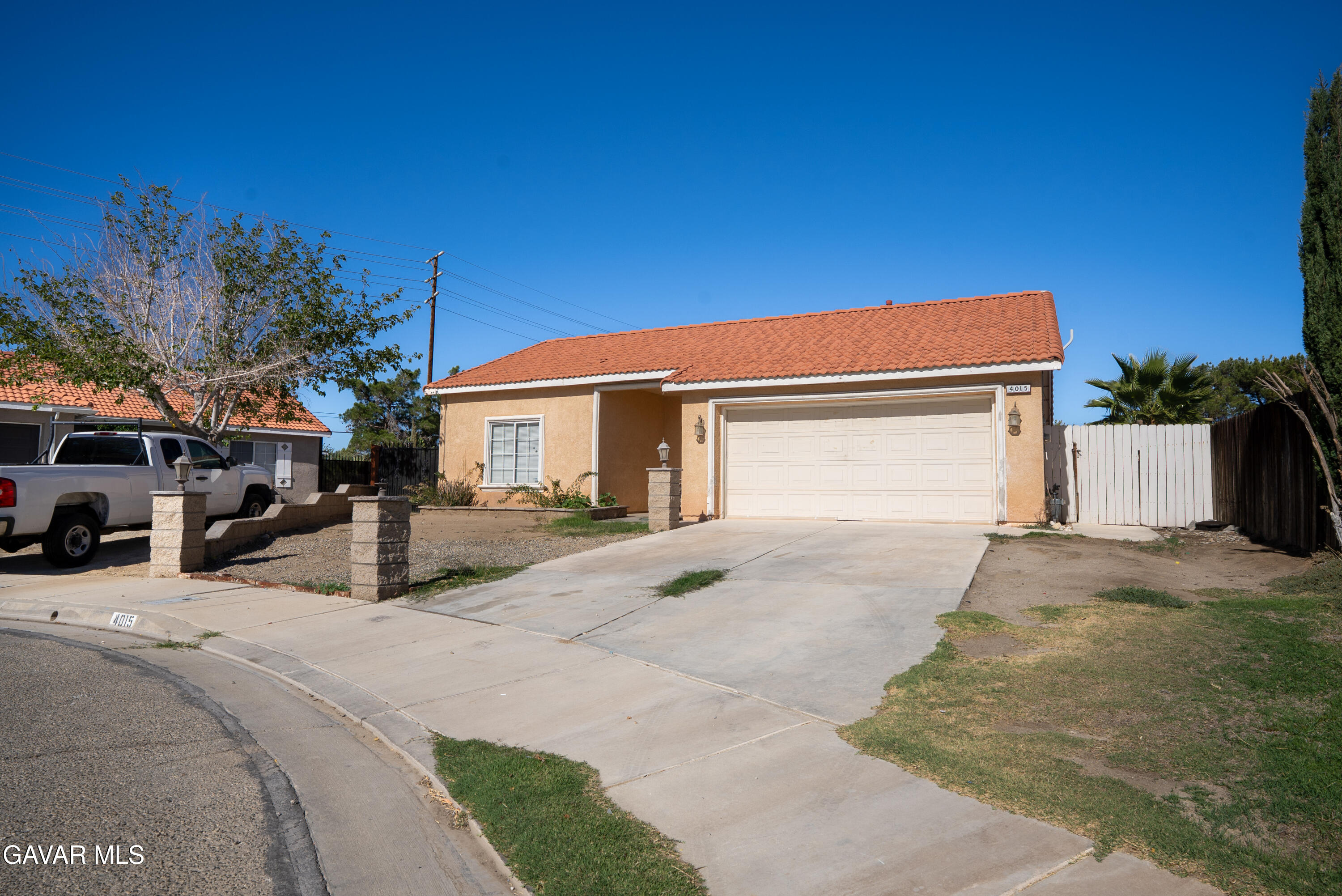 4015 Triton Drive Palmdale, CA 93552 - Photo 17 of 19 a front view of a house with cars parked