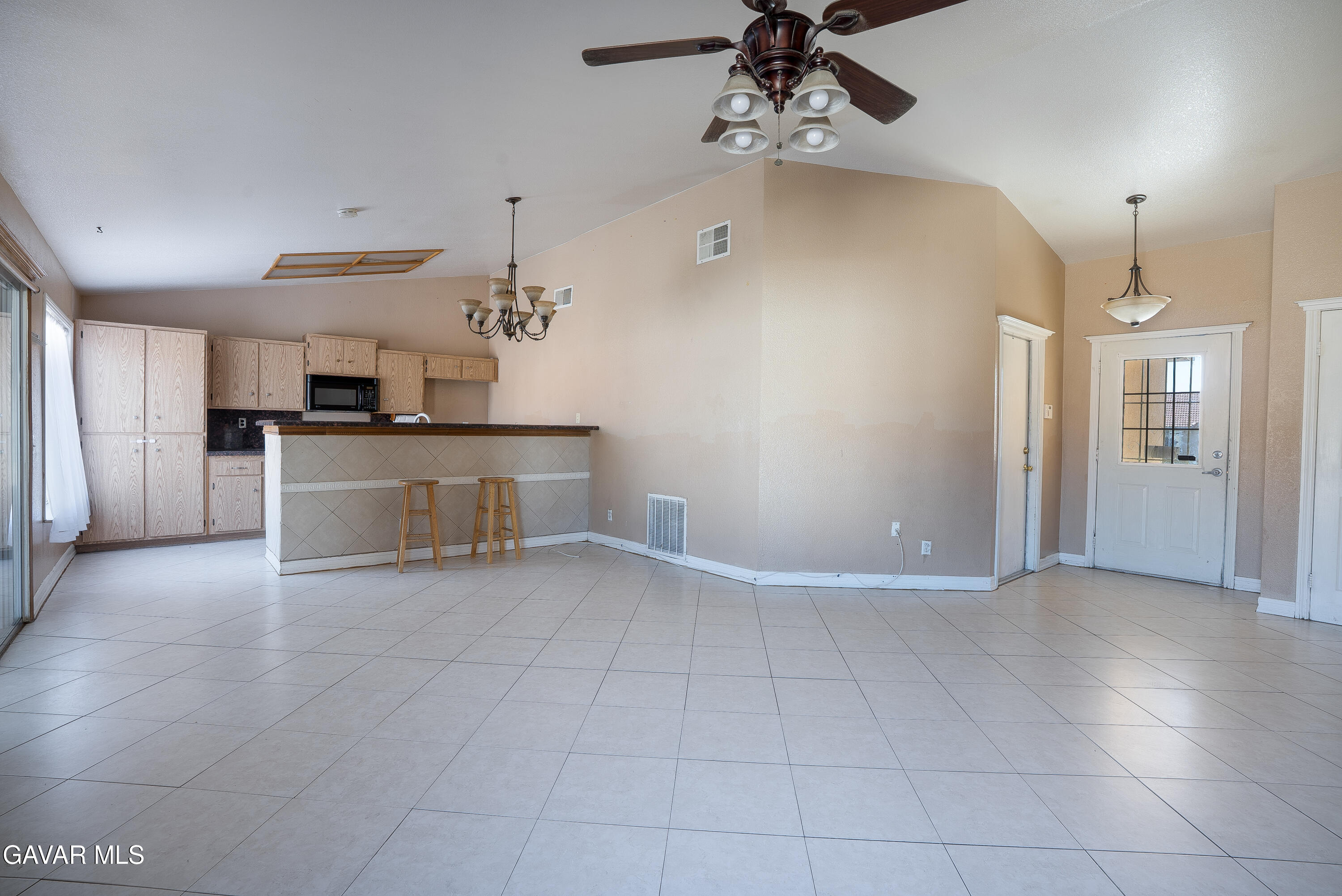 4015 Triton Drive Palmdale, CA 93552 - Photo 4 of 19 a view of a kitchen with a sink and a refrigerator