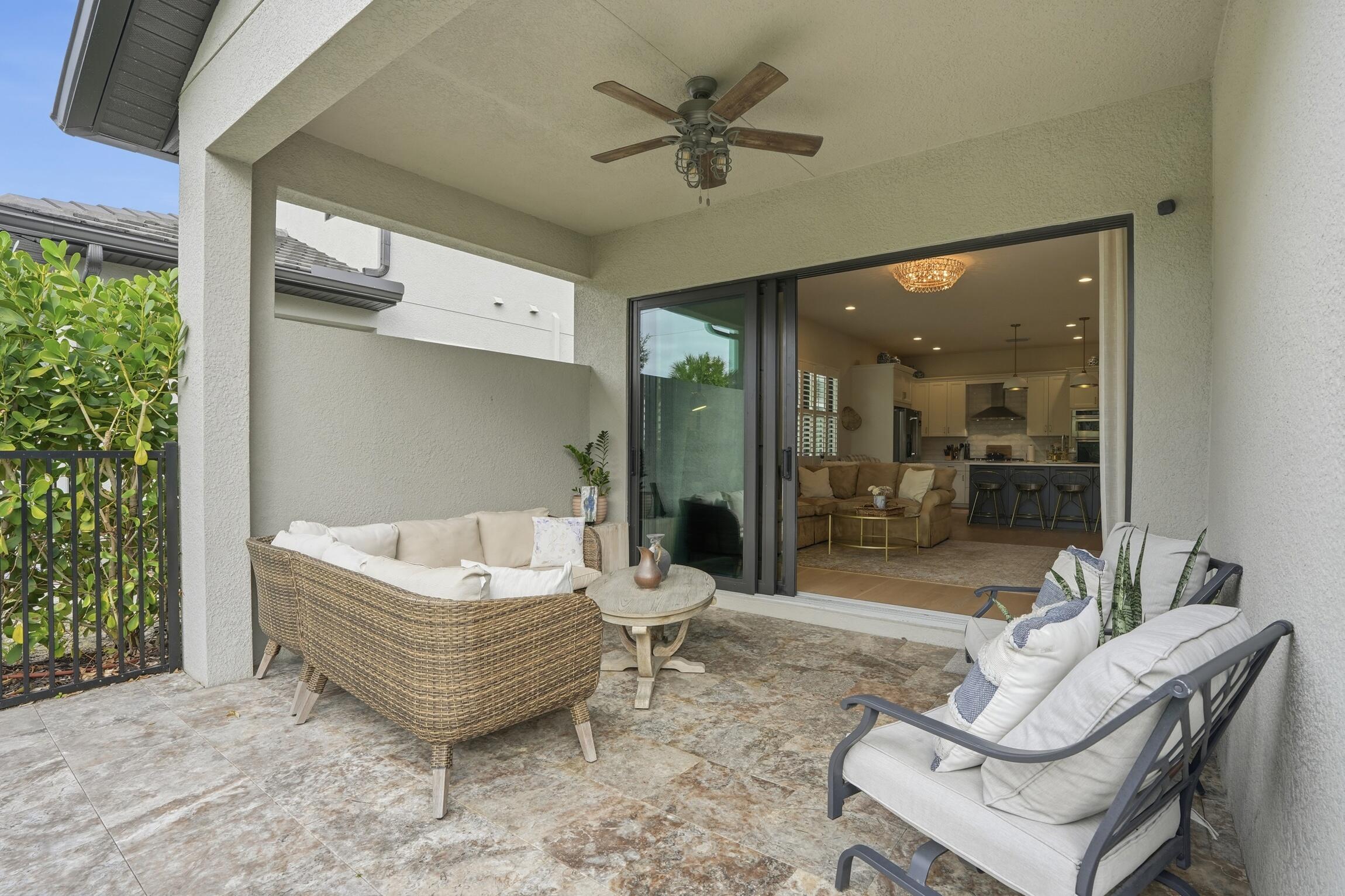 14708 Kingfisher Loop Naples, FL 34120 - Photo 32 of 42 a living room with furniture and a large window