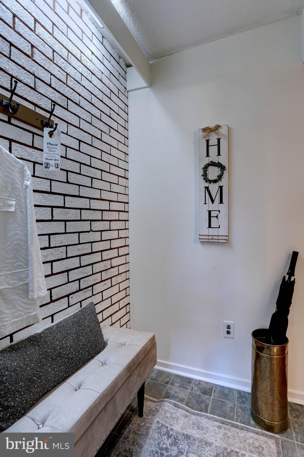 5639 Harpers Farm Road, Unit D Columbia, MD 21044 - Photo 3 of 27 Beautiful exposed brick entry way