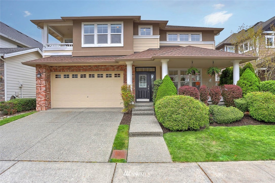 a front view of a building with garden