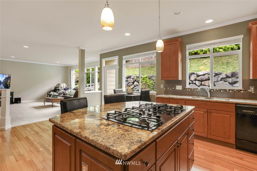 17112 164th Way Southeast Renton, WA 98058 - Photo 15 of 35 a kitchen with a stove and a refrigerator