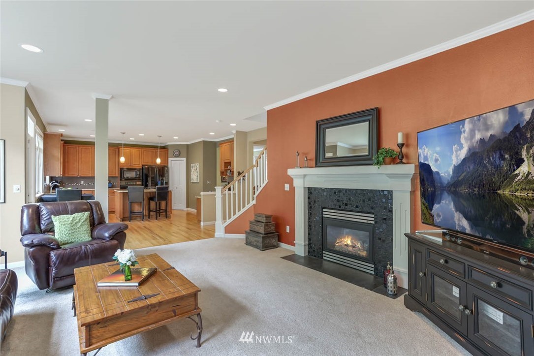 17112 164th Way Southeast Renton, WA 98058 - Photo 17 of 35 a living room with furniture and a fireplace