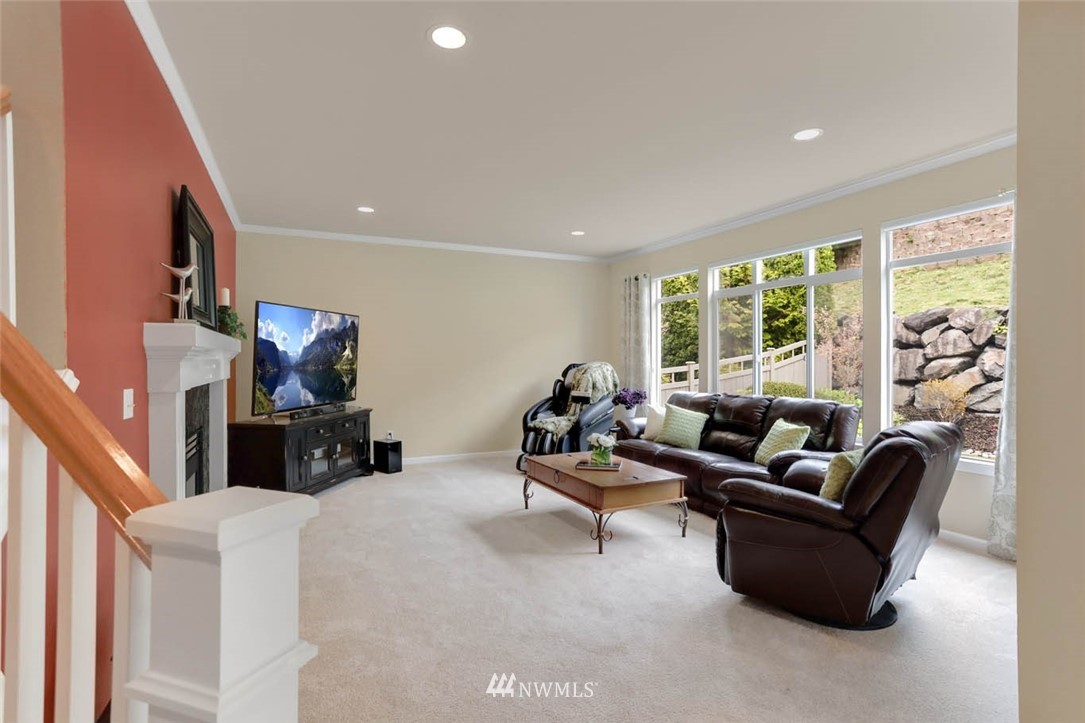 17112 164th Way Southeast Renton, WA 98058 - Photo 18 of 35 a living room with furniture and a fireplace
