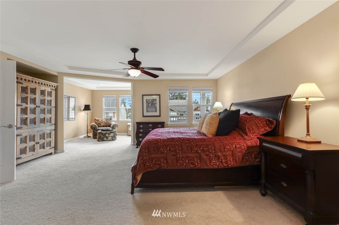 17112 164th Way Southeast Renton, WA 98058 - Photo 20 of 35 a bedroom with a bed and a lamp