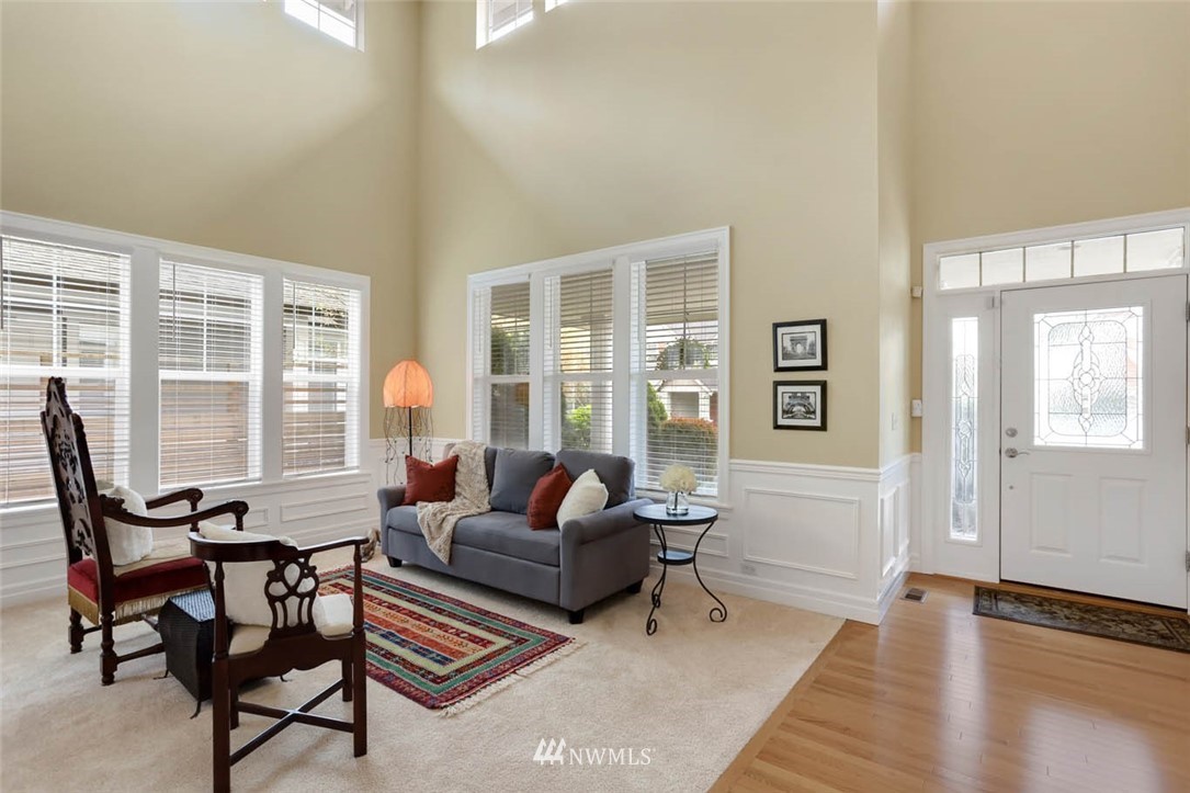 17112 164th Way Southeast Renton, WA 98058 - Photo 3 of 35 a living room with furniture and large windows