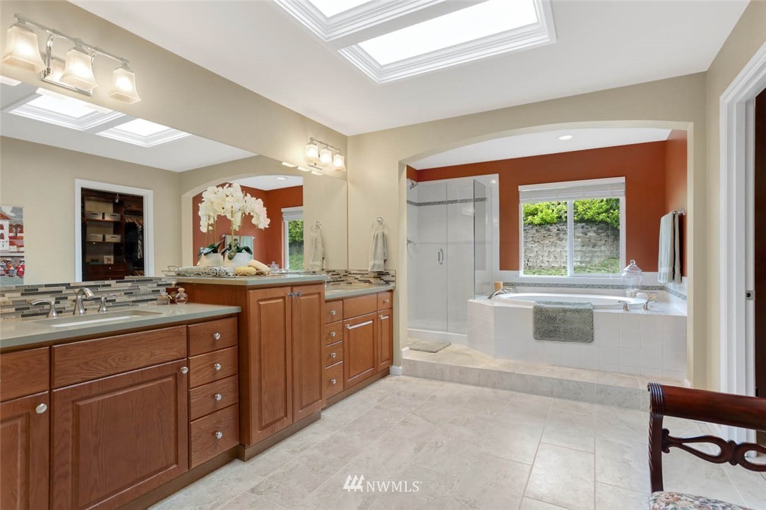 17112 164th Way Southeast Renton, WA 98058 - Photo 24 of 35 a bathroom with a granite countertop sink toilet and mirror