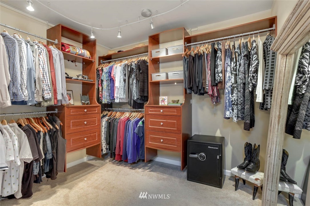 17112 164th Way Southeast Renton, WA 98058 - Photo 26 of 35 a view of walk in closet with clothes and shoes