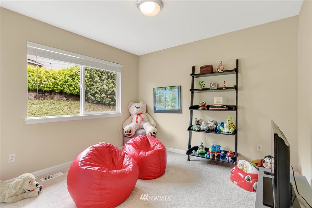 17112 164th Way Southeast Renton, WA 98058 - Photo 30 of 35 a bedroom with a bed and a window