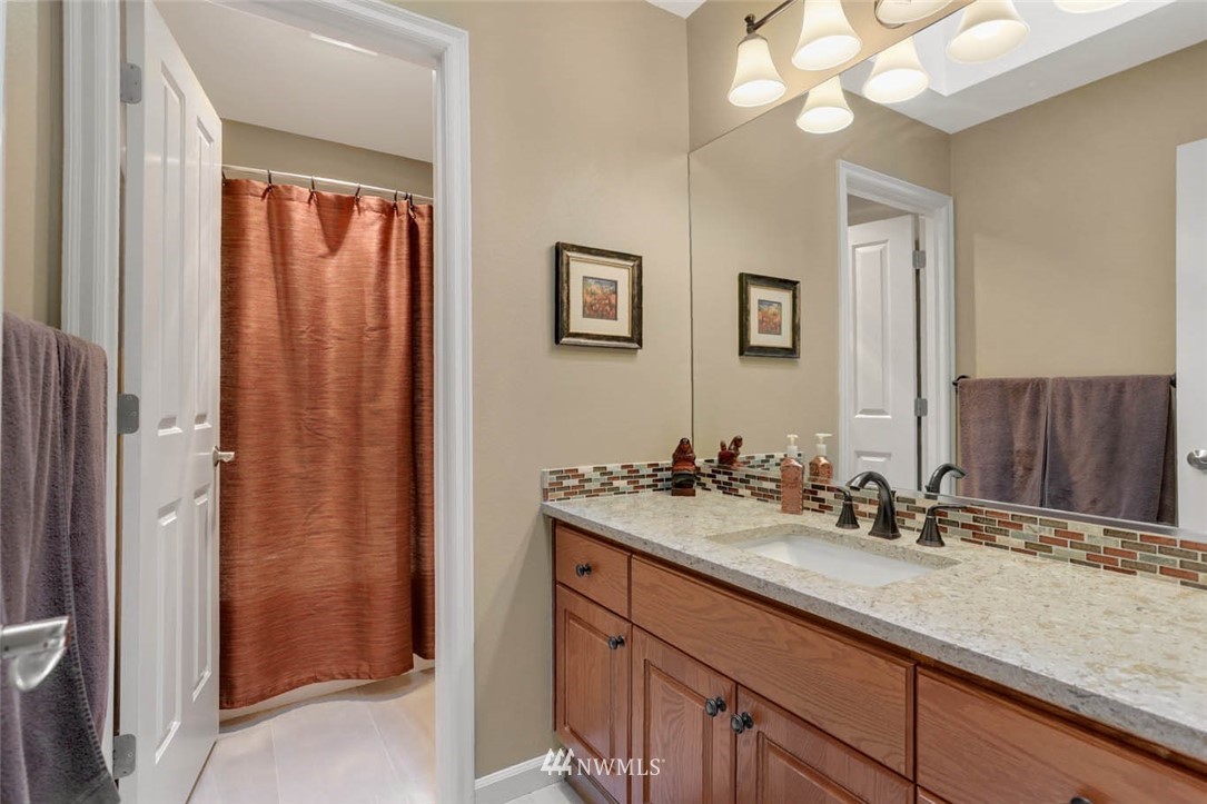 17112 164th Way Southeast Renton, WA 98058 - Photo 31 of 35 a bathroom with a sink and a mirror