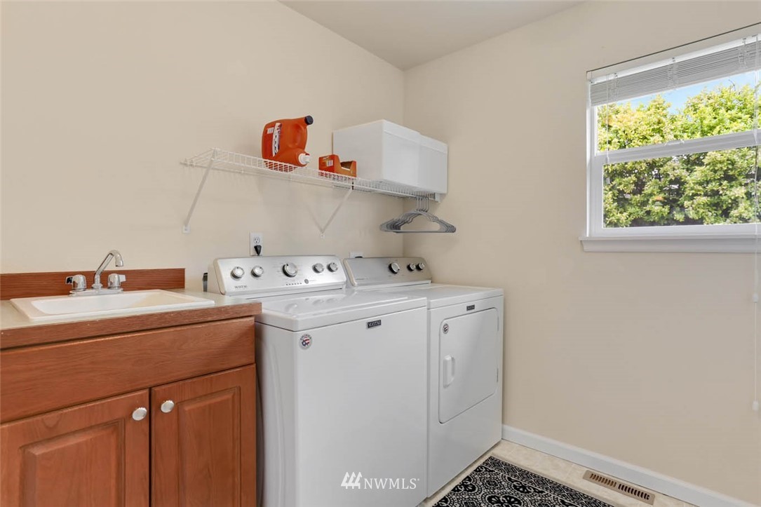 17112 164th Way Southeast Renton, WA 98058 - Photo 32 of 35 a utility room with sink dryer and washer
