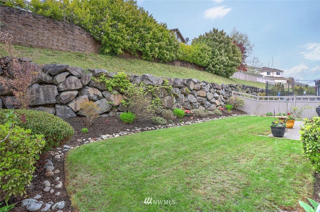 17112 164th Way Southeast Renton, WA 98058 - Photo 35 of 35 a view of a garden with an empty room