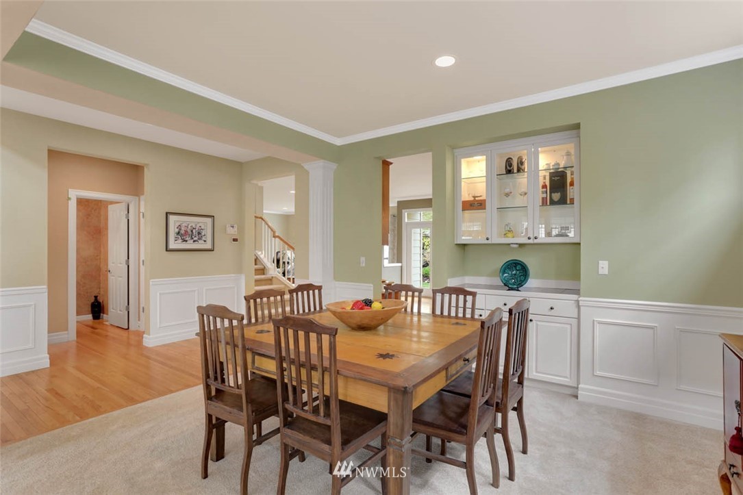 17112 164th Way Southeast Renton, WA 98058 - Photo 6 of 35 a view of a dining room with furniture window and wooden floor