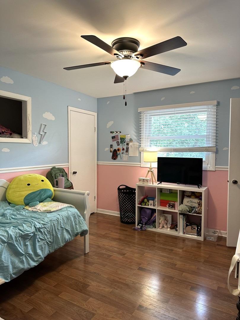 8693 Durbin Lane Crown Point, IN 46307 - Photo 11 of 18 a bedroom with furniture and a flat screen tv
