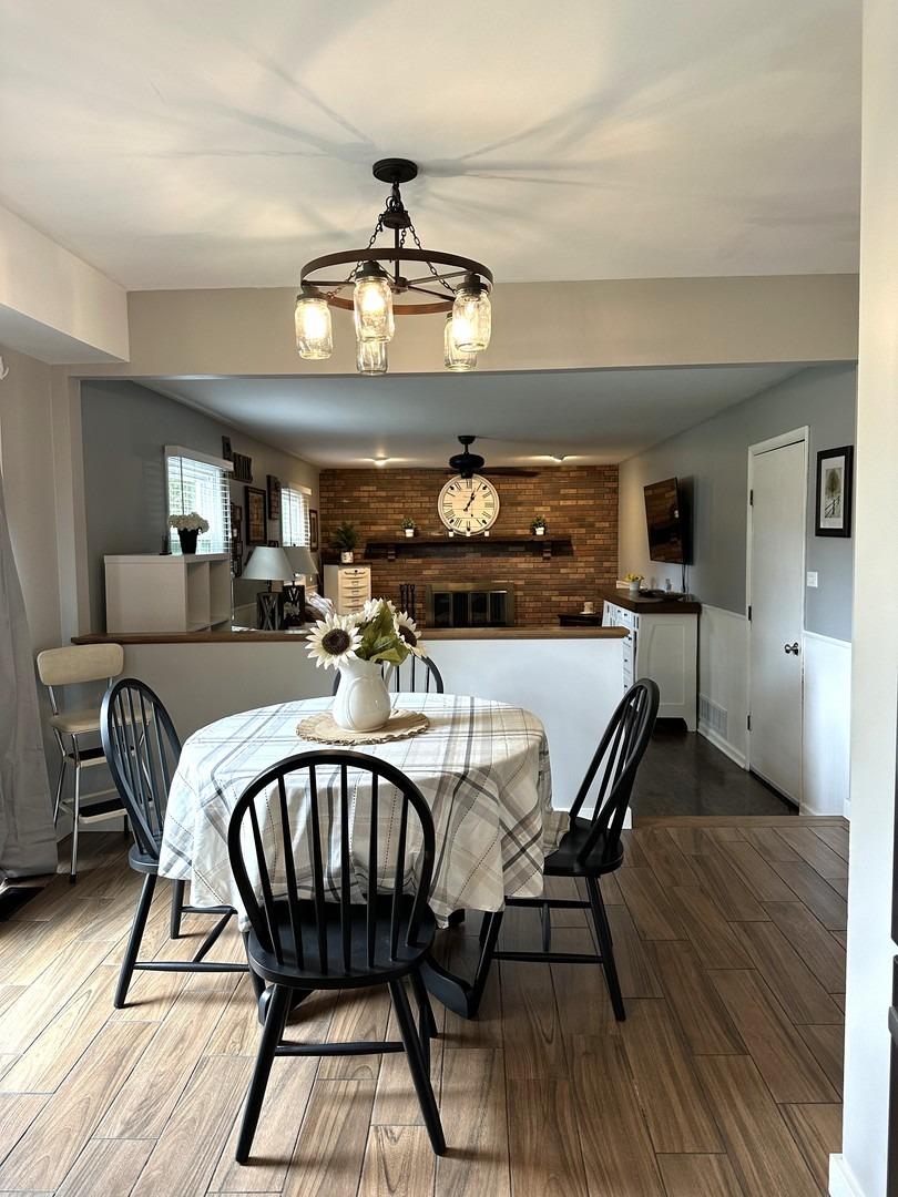 8693 Durbin Lane Crown Point, IN 46307 - Photo 9 of 18 a view of a dining room with furniture and wooden floor