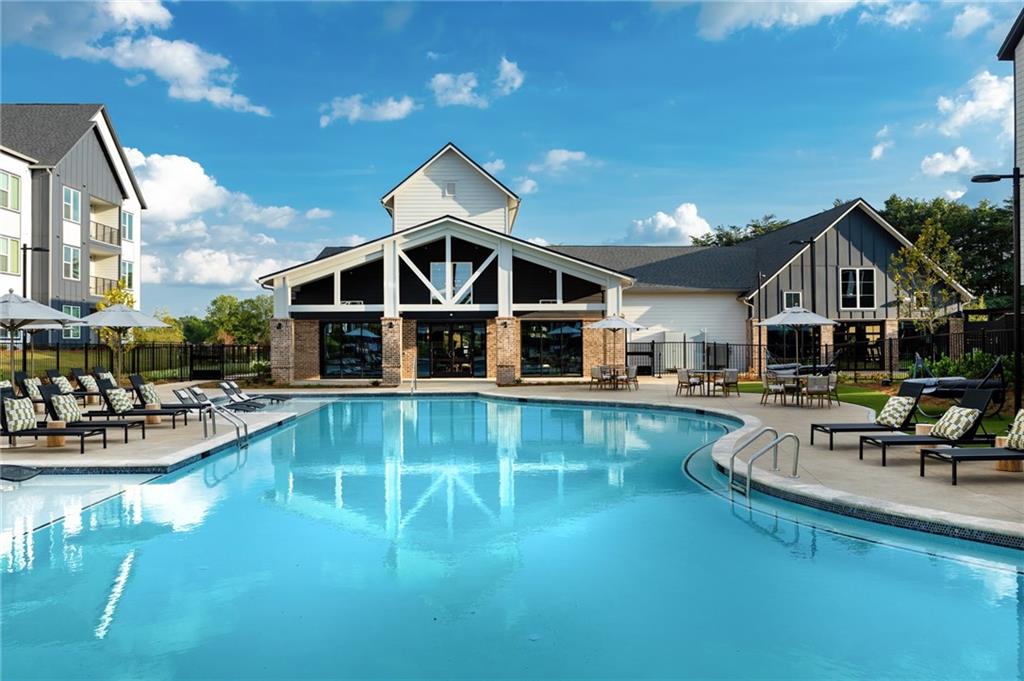 3890 Floyd Road Southwest, Unit THB1 Austell, GA 30106 - Photo 15 of 40 a view of a house with swimming pool