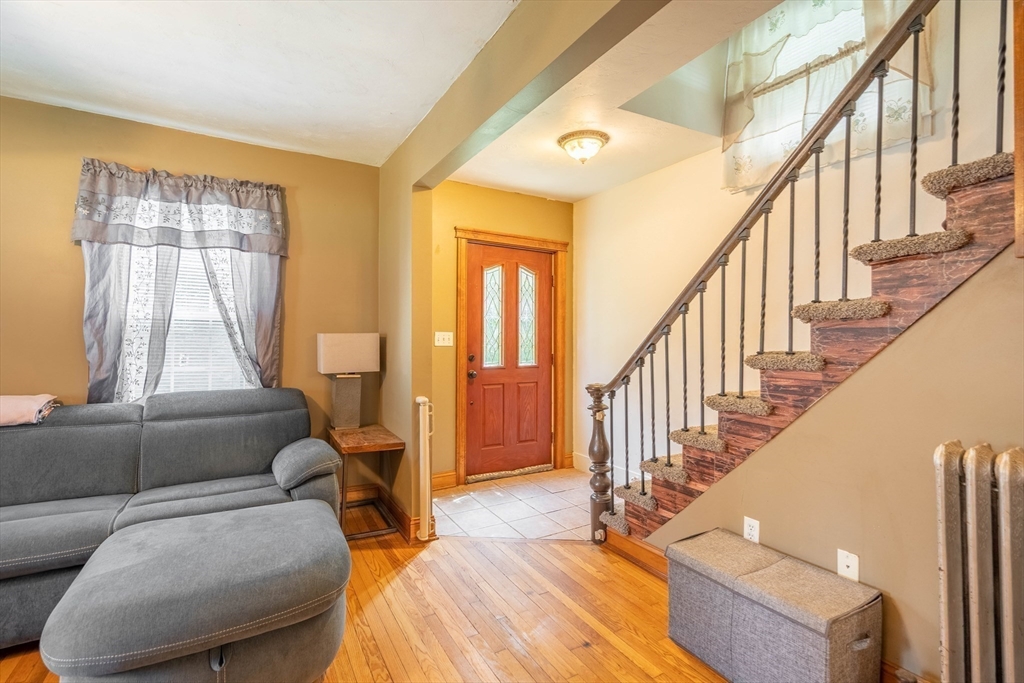 4 Walnut Street Brookfield, MA 01506 - Photo 16 of 33 a living room with furniture and a hard wood floor