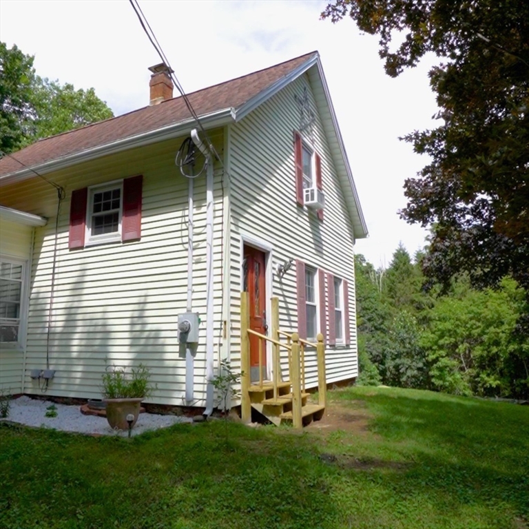 4 Walnut Street Brookfield, MA 01506 - Photo 2 of 33 a view of a house with a yard