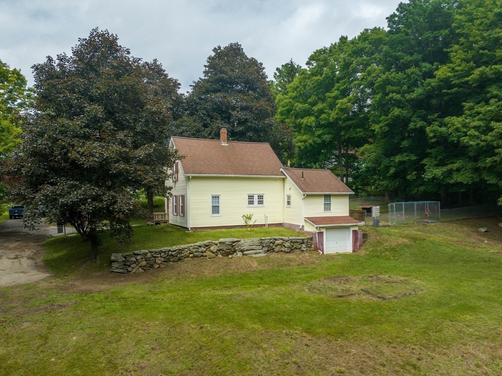 4 Walnut Street Brookfield, MA 01506 - Photo 25 of 33 a front view of a house with garden