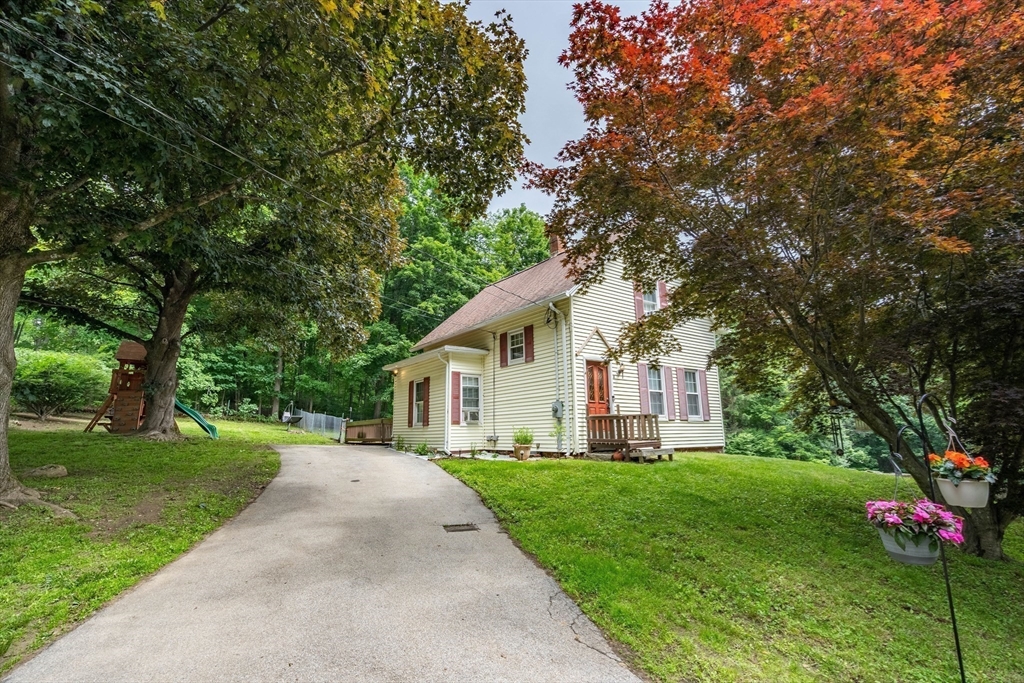 4 Walnut Street Brookfield, MA 01506 - Photo 4 of 33 a front view of house with yard and green space
