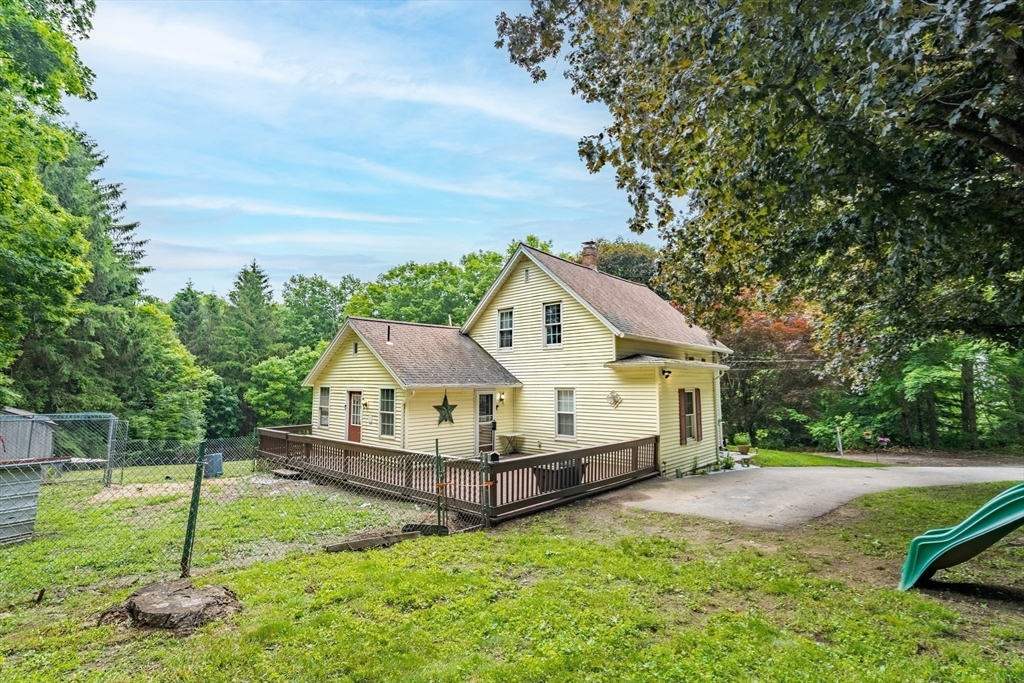 4 Walnut Street Brookfield, MA 01506 - Photo 5 of 33 a house with trees in the background