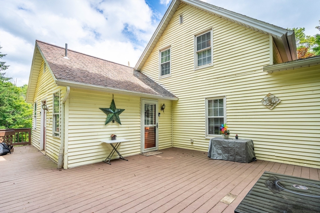 4 Walnut Street Brookfield, MA 01506 - Photo 6 of 33 a view of a house with a backyard and stairs