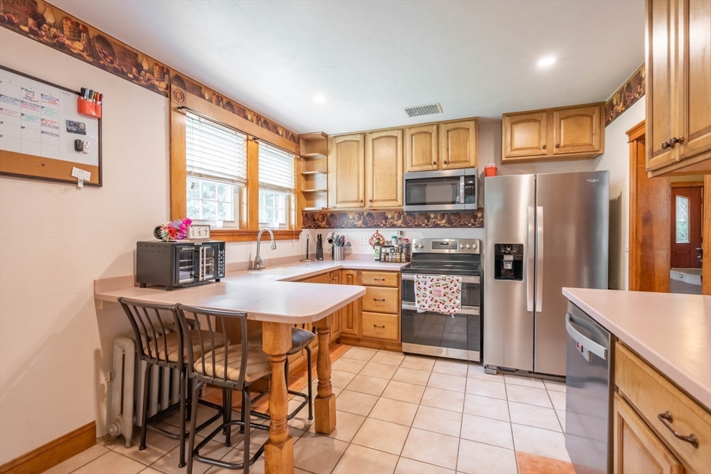 4 Walnut Street Brookfield, MA 01506 - Photo 10 of 33 a kitchen with refrigerator a stove and a refrigerator