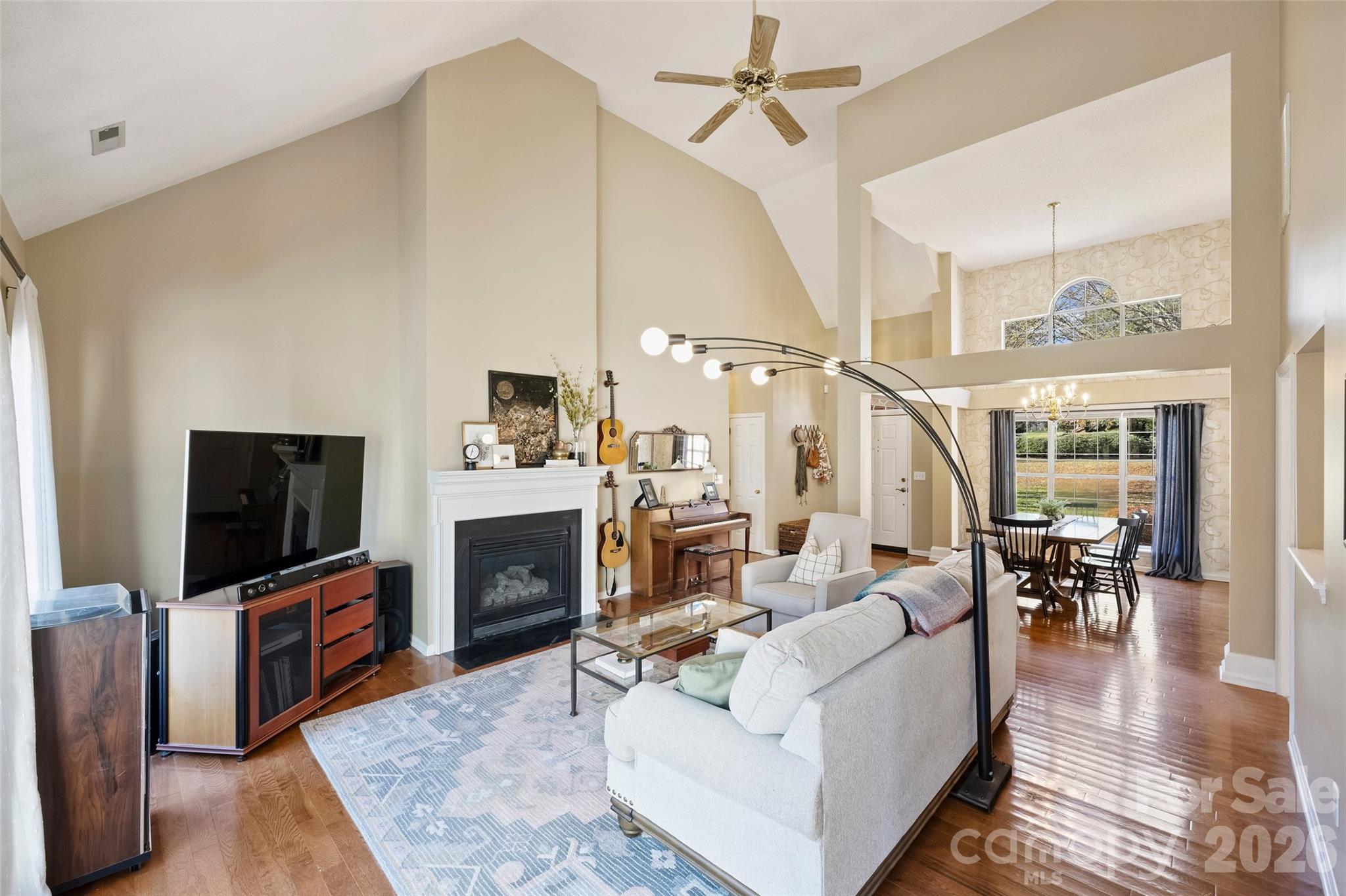 15346 Yarmouth Road Mint Hill, NC 28227 - Photo 11 of 43 a living room with furniture a fireplace and a flat screen tv