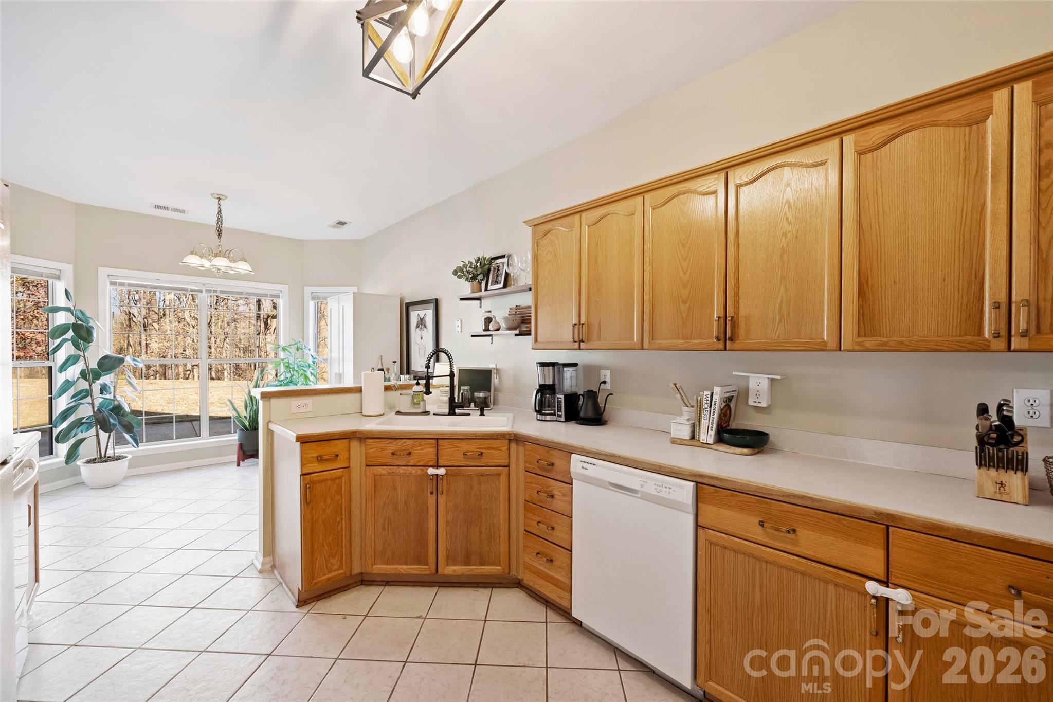 15346 Yarmouth Road Mint Hill, NC 28227 - Photo 13 of 43 a kitchen with a sink window and cabinets