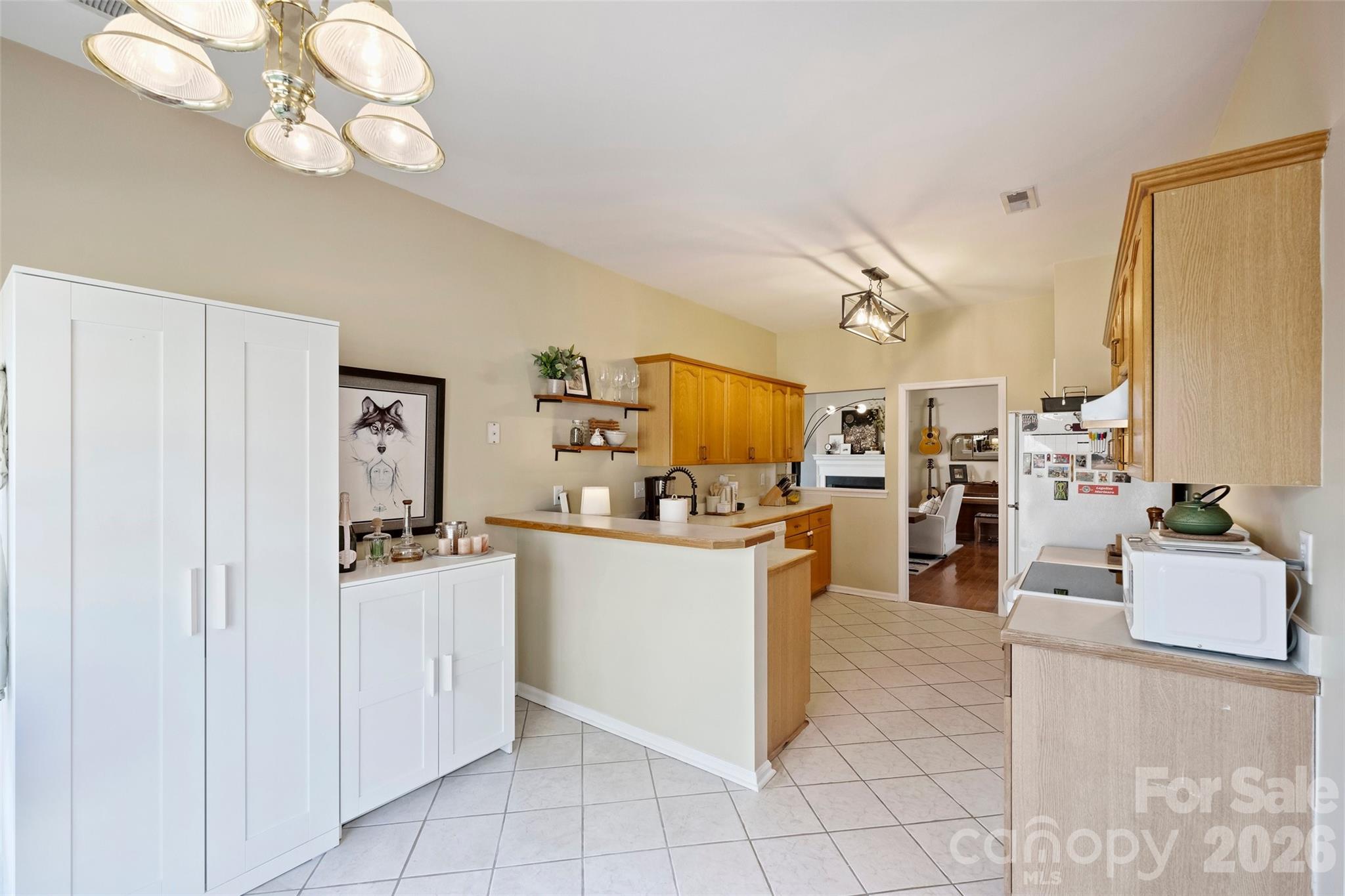 15346 Yarmouth Road Mint Hill, NC 28227 - Photo 14 of 43 a kitchen with cabinets and chairs