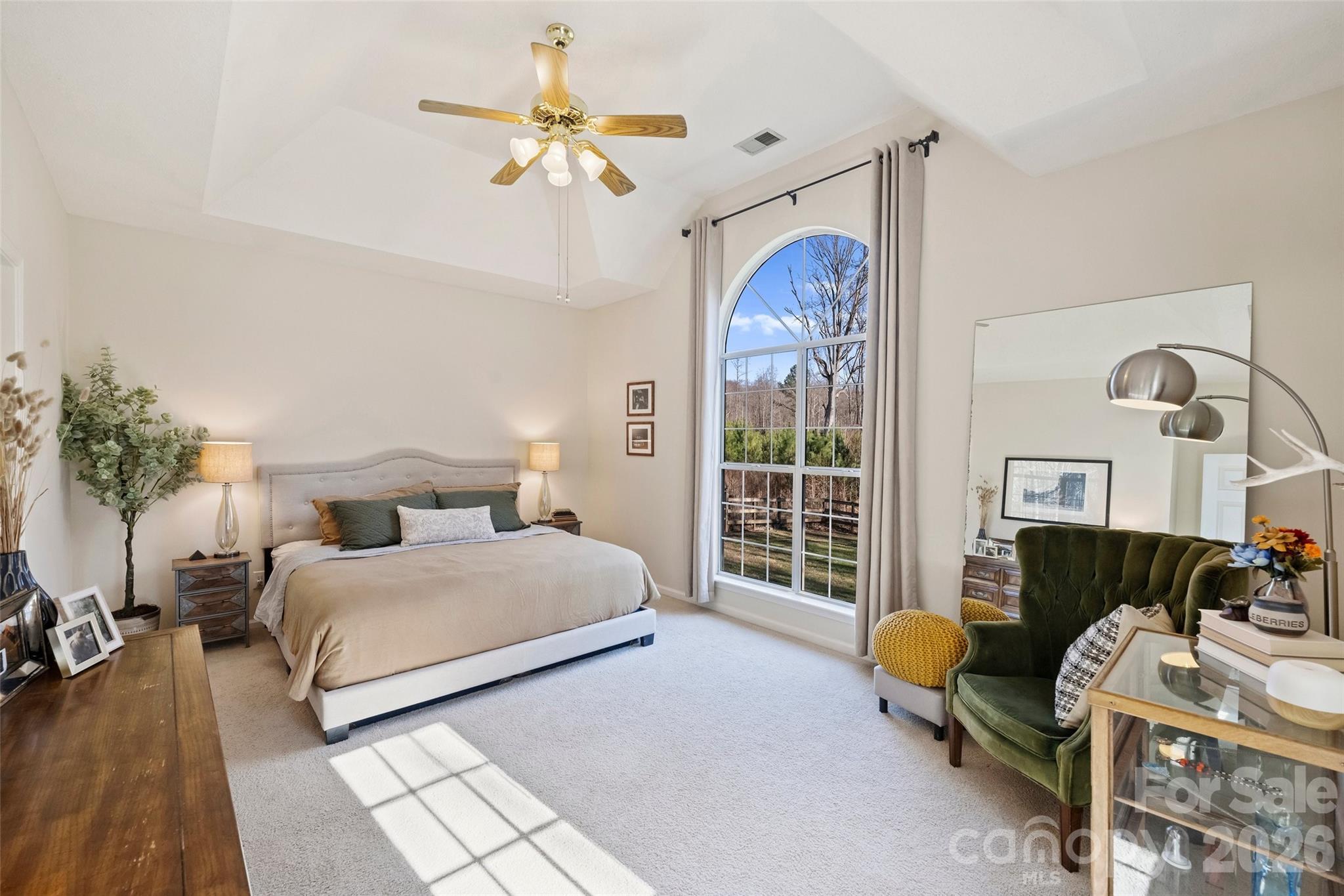 15346 Yarmouth Road Mint Hill, NC 28227 - Photo 20 of 43 a bedroom with a bed and a chandelier