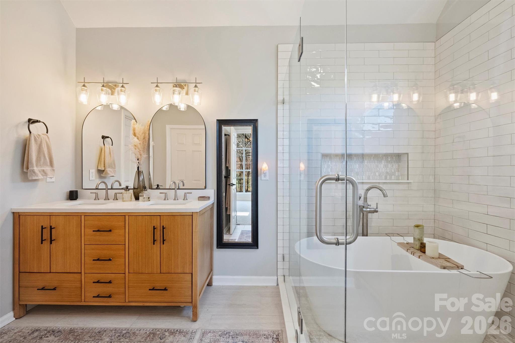 15346 Yarmouth Road Mint Hill, NC 28227 - Photo 22 of 43 a bathroom with a double vanity sink mirror and bathtub