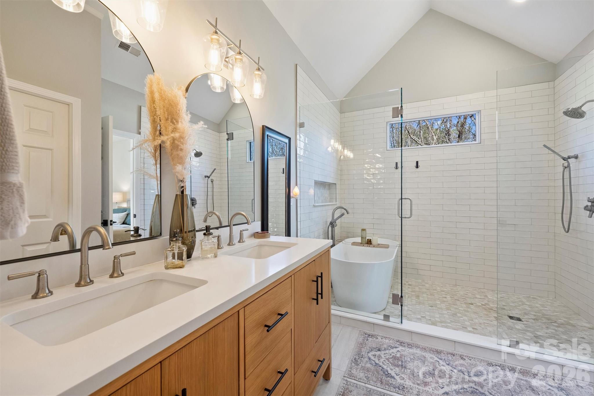 15346 Yarmouth Road Mint Hill, NC 28227 - Photo 23 of 43 a bathroom with a double vanity sink mirror and shower