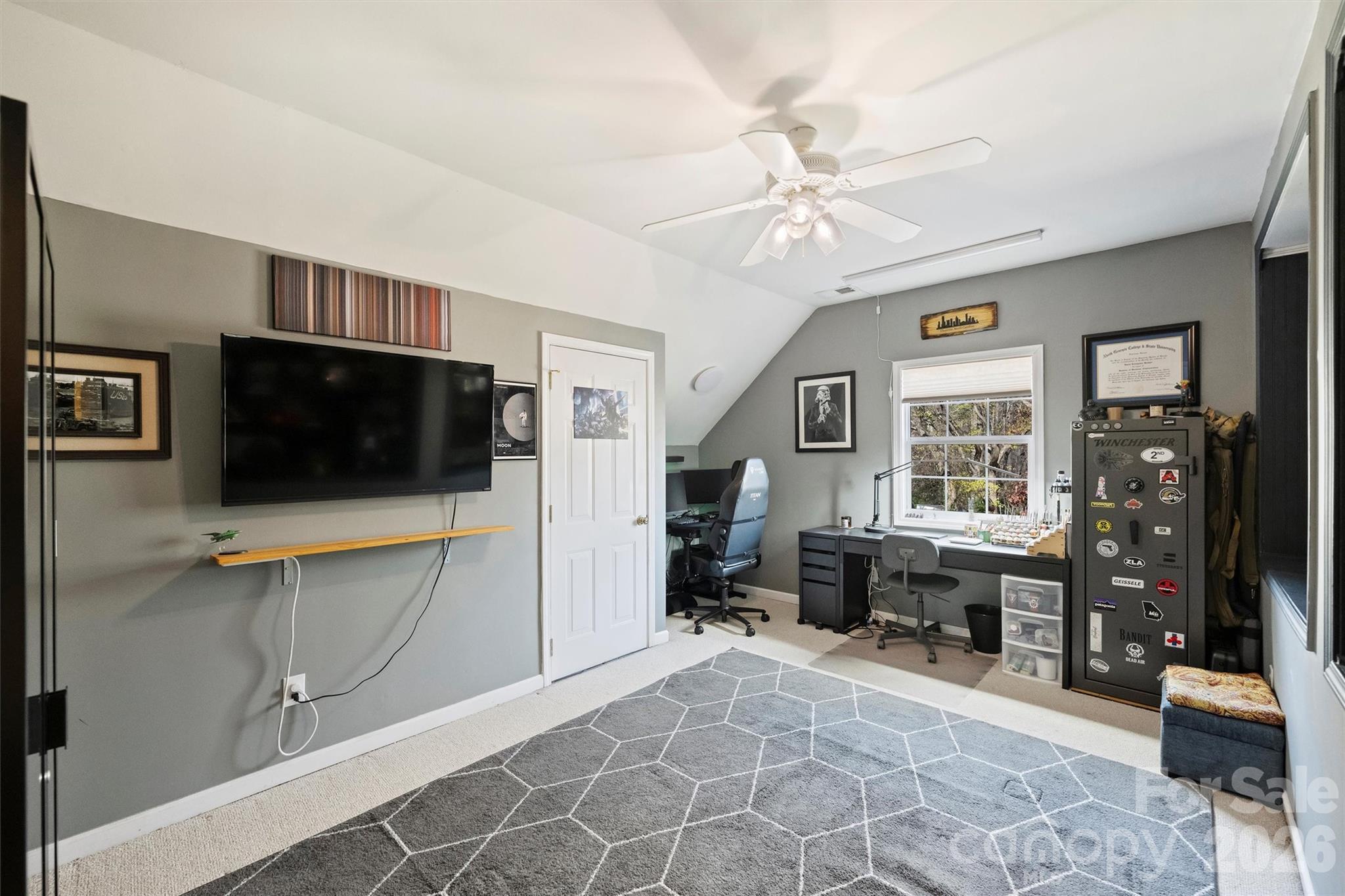 15346 Yarmouth Road Mint Hill, NC 28227 - Photo 32 of 43 a view of a livingroom with furniture and a flat screen tv