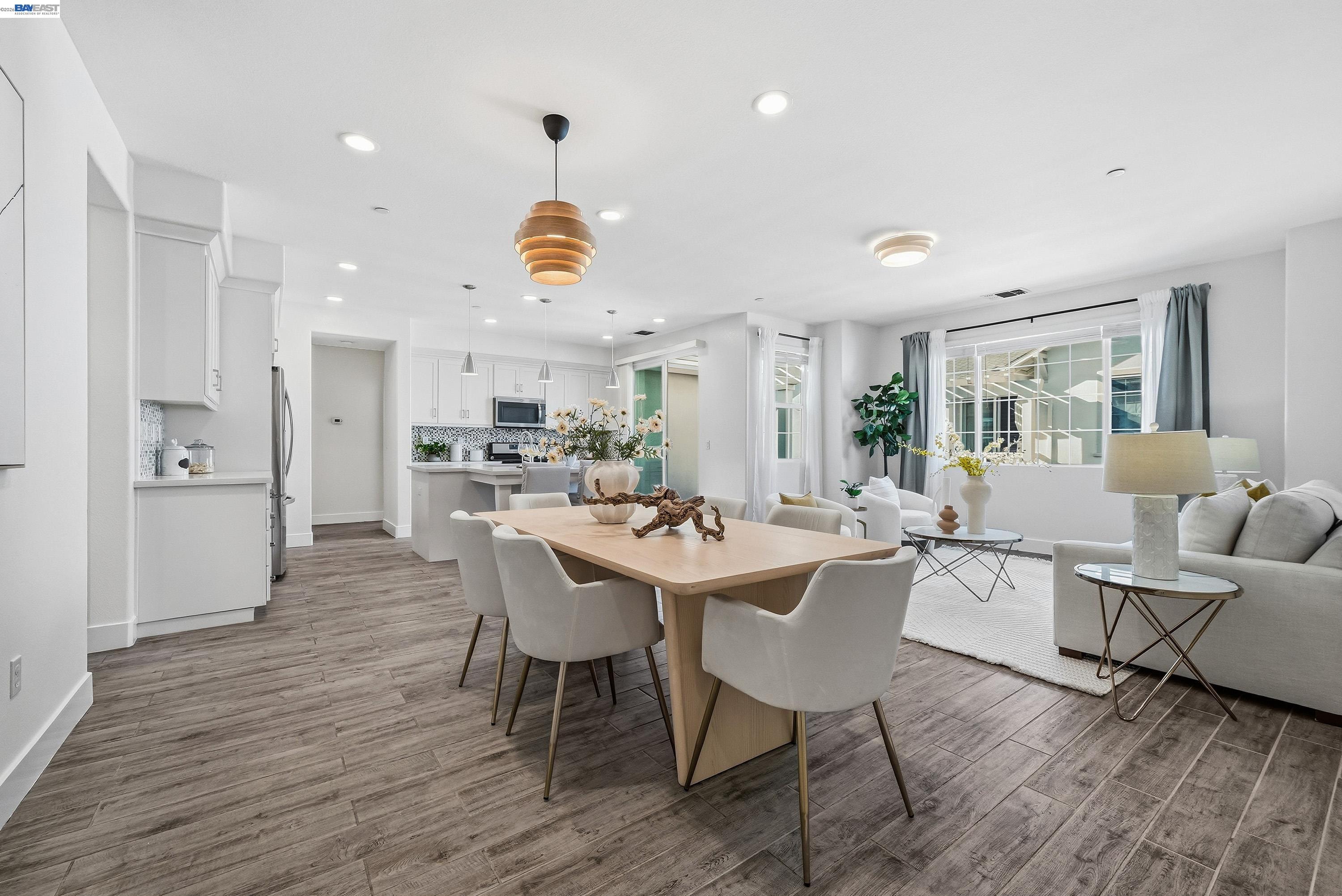 a view of a dining room with furniture and wooden floor
