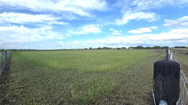 a view of a lake with a big yard