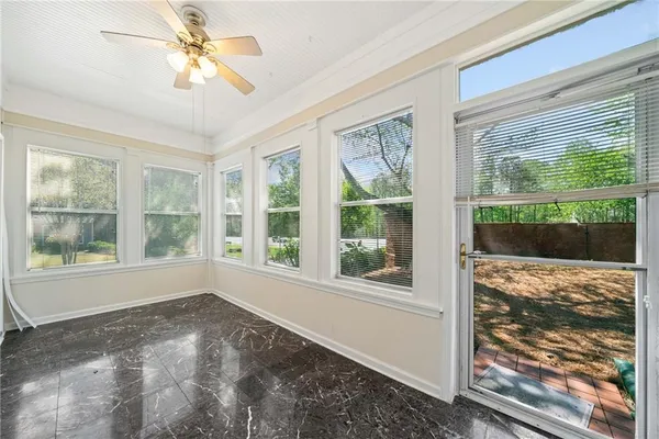 a view of a room that has a large window