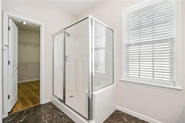 a view of a bedroom with natural light