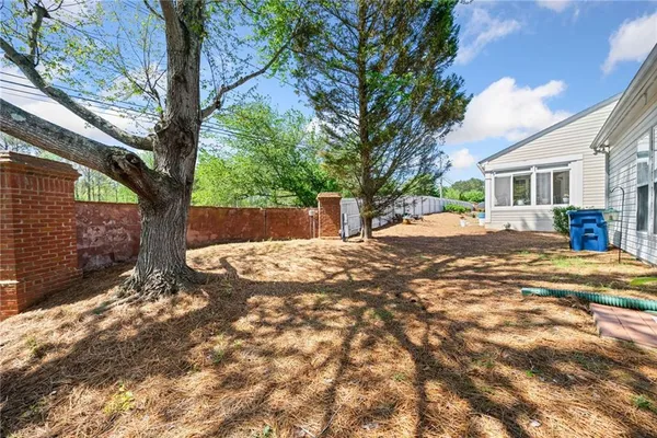 a view of a yard with a tree