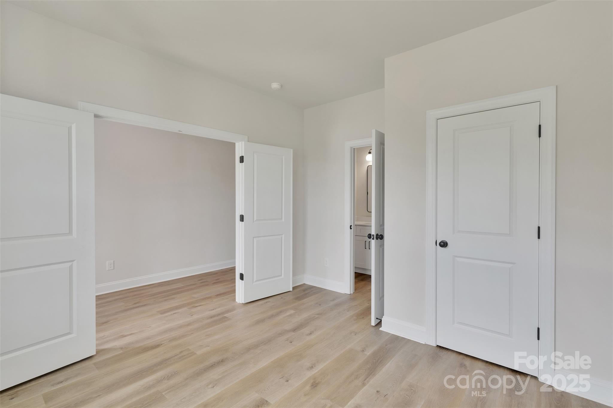 1809 Country Club Road, Unit 3 Lincolnton, NC 28092 - Photo 11 of 43 a view of an empty room with wooden floor and closet area
