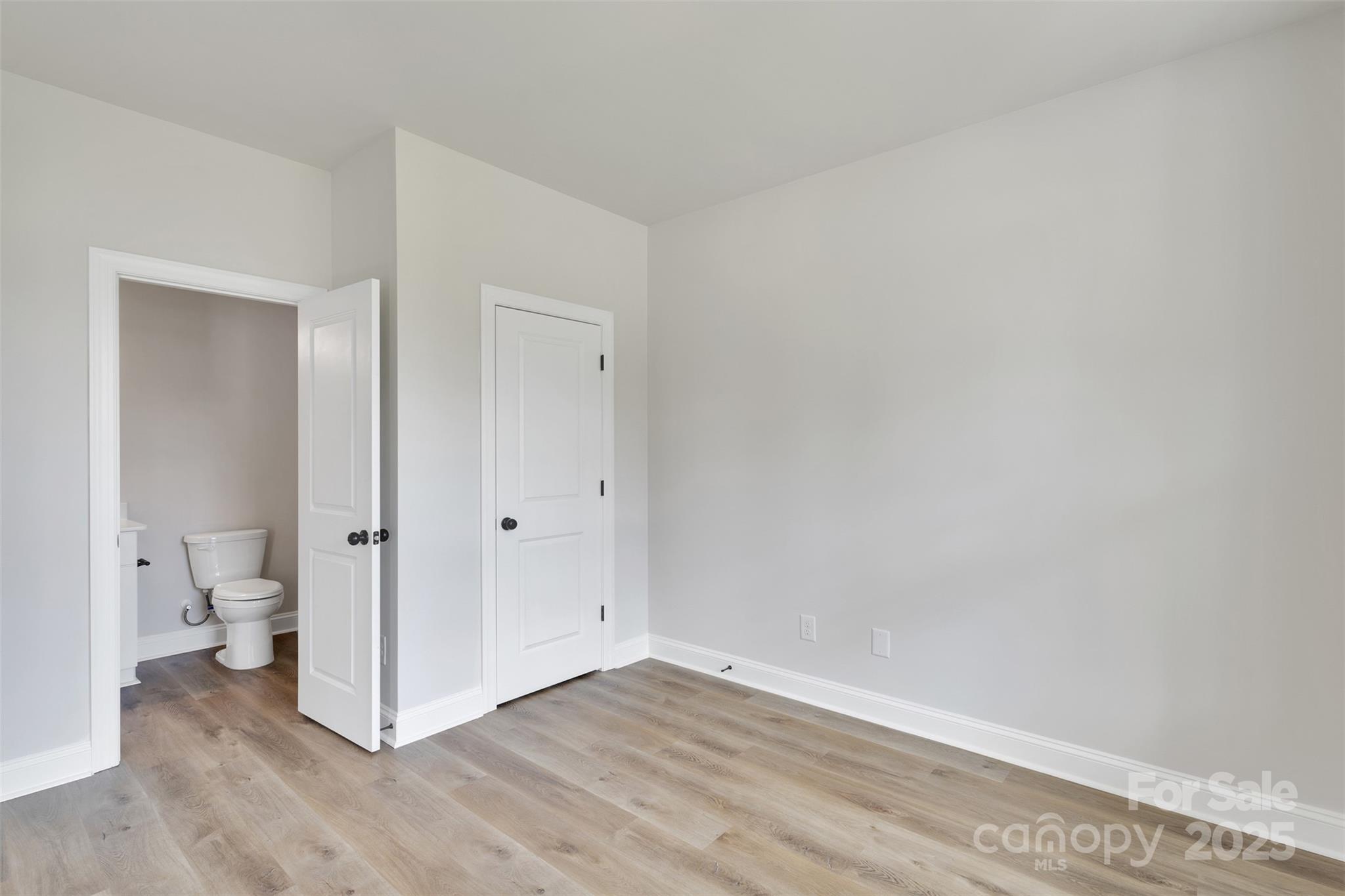 1809 Country Club Road, Unit 3 Lincolnton, NC 28092 - Photo 12 of 43 a view of a room with wooden floor and a toilet