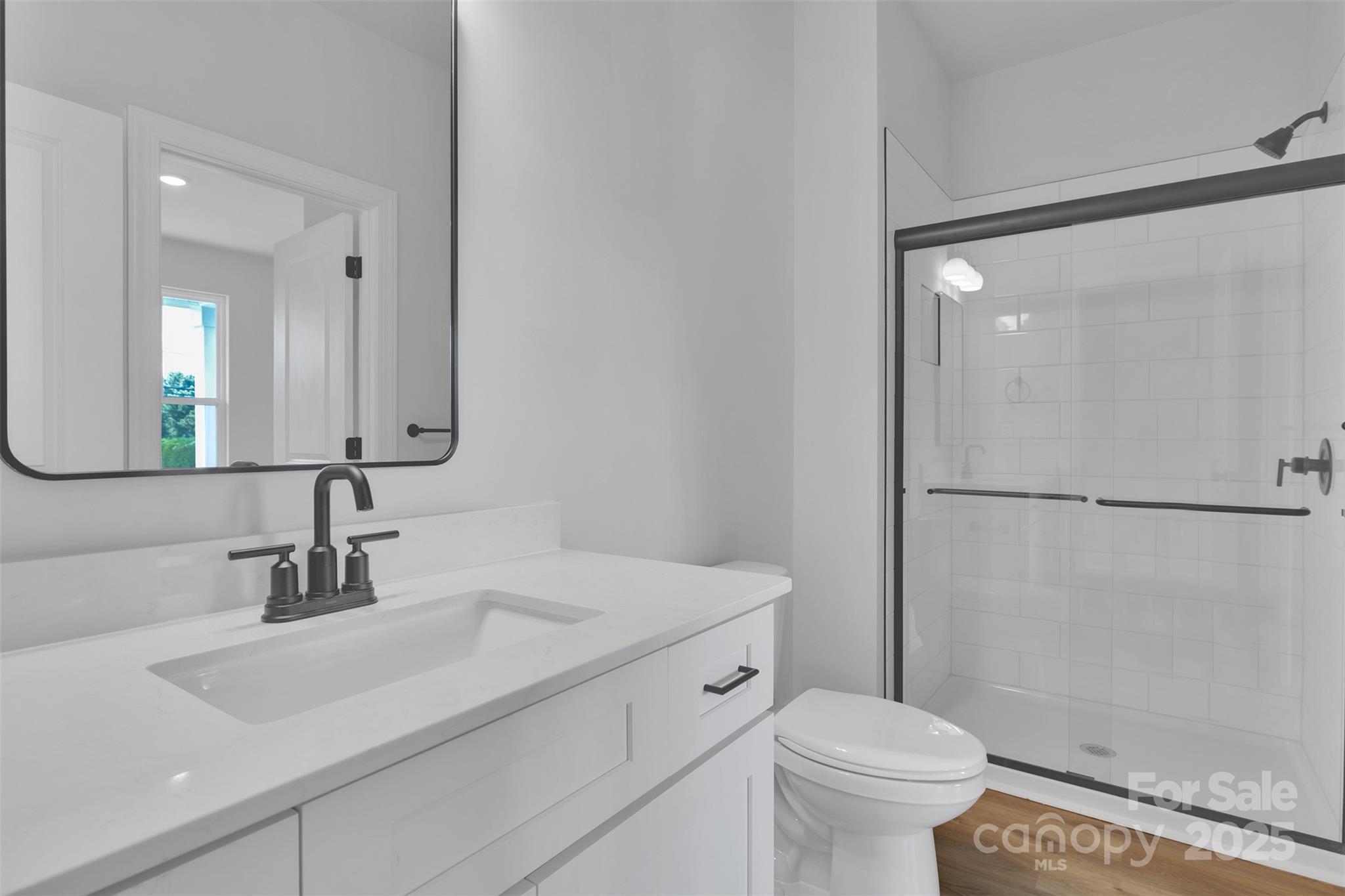 1809 Country Club Road, Unit 3 Lincolnton, NC 28092 - Photo 14 of 43 a bathroom with a sink toilet and shower