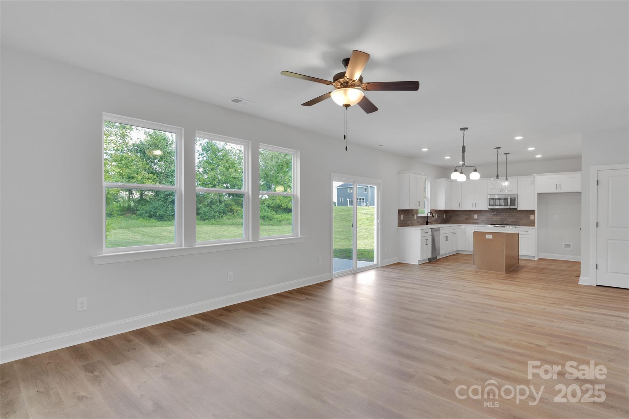 1809 Country Club Road, Unit 3 Lincolnton, NC 28092 - Photo 16 of 43 a view of an empty room with window and wooden floor